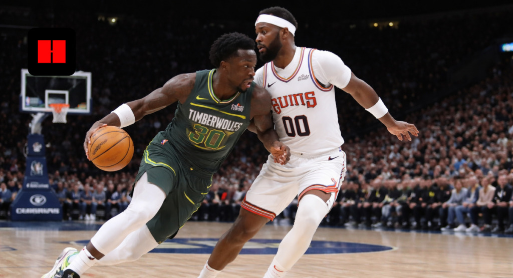 Minnesota Timberwolves forward drives past Phoenix Suns defender during NBA game action at Target Center.