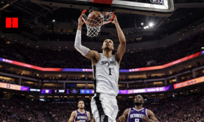 Victor Wembanyama dunking for San Antonio Spurs against Sacramento Kings at Golden 1 Center during NBA game.