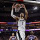 Victor Wembanyama dunking for San Antonio Spurs against Sacramento Kings at Golden 1 Center during NBA game.
