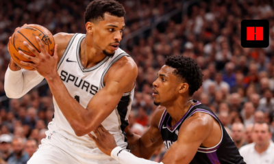 Victor Wembanyama backs down Suns defender in Spurs vs Suns NBA game high-resolution action shot