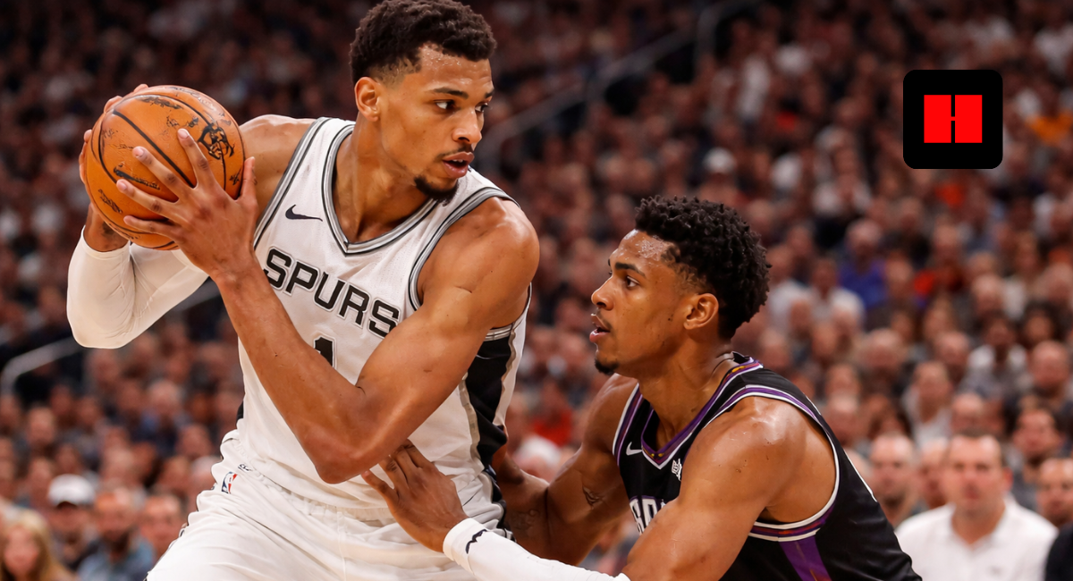 Victor Wembanyama backs down Suns defender in Spurs vs Suns NBA game high-resolution action shot
