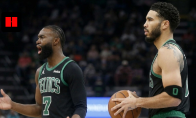 Jaylen Brown shouting and Jayson Tatum holding a basketball during a Boston Celtics game, side view.