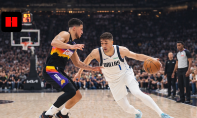 Dallas Mavericks player dribbling past Phoenix Suns defender during an NBA basketball game in UHD action shot