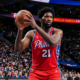 Joel Embiid holds the ball at the Wells Fargo Center during a Philadelphia 76ers game amid Daryl Morey controversy