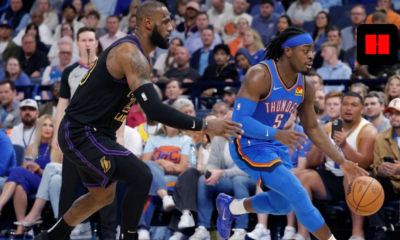 LeBron James in a black Los Angeles Lakers jersey defending Luguentz Dort of the Oklahoma City Thunder during an NBA game.