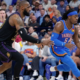 LeBron James in a black Los Angeles Lakers jersey defending Luguentz Dort of the Oklahoma City Thunder during an NBA game.
