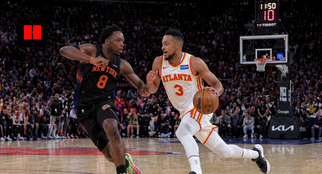 Atlanta Hawks player dribbling past New York Knicks defender during NBA game fast break action on court