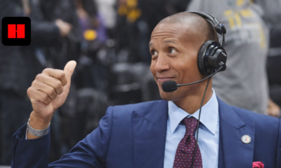 NBA commentator wearing a headset analyzing the game courtside