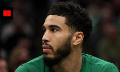 Profile shot of Jayson Tatum looking away, wearing a green Boston Celtics uniform with sponsorship logos