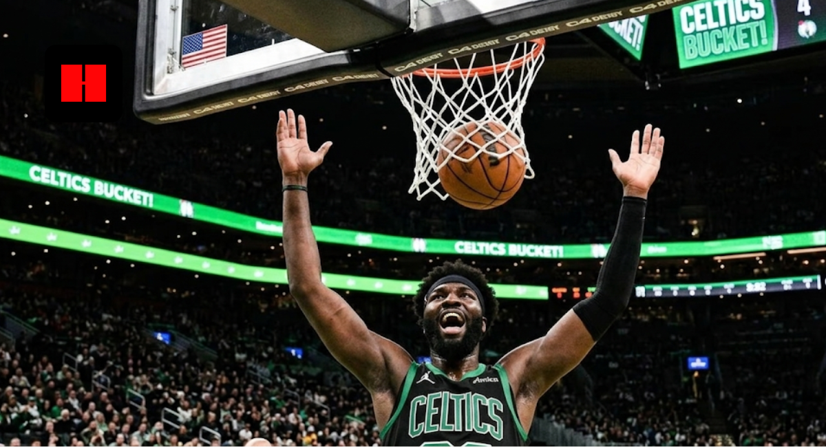 Boston Celtics center Neemias Queta celebrating with a shrug under the basket during an NBA game at TD Garden.