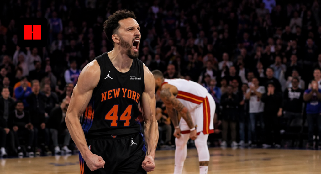 New York basketball player celebrating intensely during a live game with crowd in background