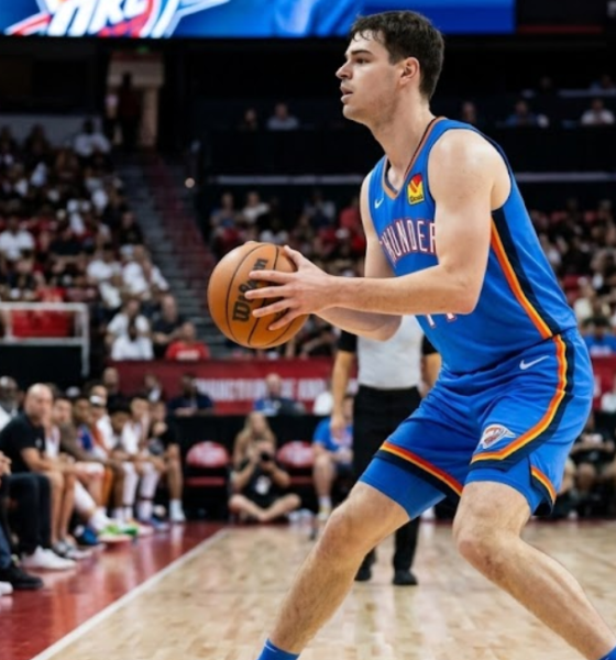 Oklahoma City Thunder guard Nikola Topić holding a basketball in a triple-threat stance during an NBA Summer League game.