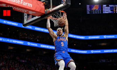 Alex Caruso of the Oklahoma City Thunder throws down a two-handed dunk against the Phoenix Suns during the 2026 NBA Playoffs game in Phoenix