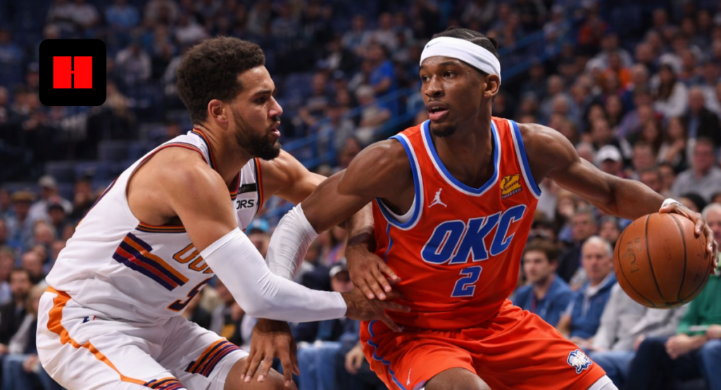 Oklahoma City Thunder player driving to the basket while guarded by Phoenix Suns defender during NBA game action