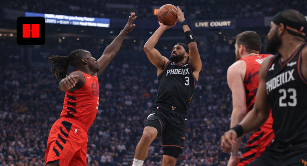 Phoenix Suns player making a jump shot against Toronto Raptors defenders during an NBA game