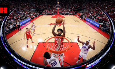 Tari Eason rises for a powerful dunk at the rim during a Houston Rockets game as defenders contest underneath