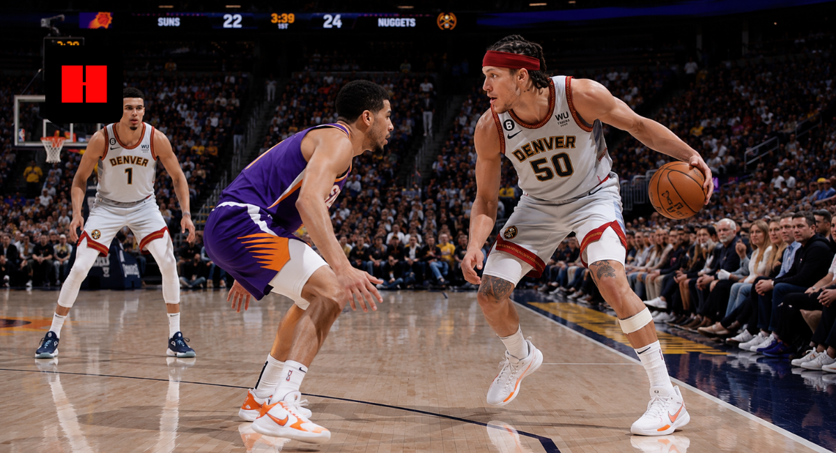 Denver Nuggets forward Aaron Gordon dribbling against Phoenix Suns defender during NBA game with teammate spacing the floor in a packed arena