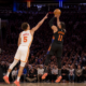 Jalen Brunson of the New York Knicks shoots a contested jump shot over Daniels during an NBA game at Madison Square Garden in 2026