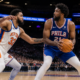 Joel Embiid of the Philadelphia 76ers backing down Karl-Anthony Towns of the New York Knicks during an NBA game action shot