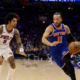 New York Knicks guard Jalen Brunson drives past Philadelphia 76ers forward Kelly Oubre Jr during an NBA game at Wells Fargo Center.